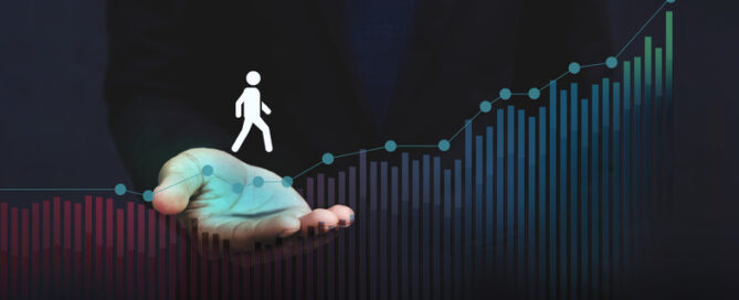 An icon of a person walking along a bar graph, symbolic of the members journey.
